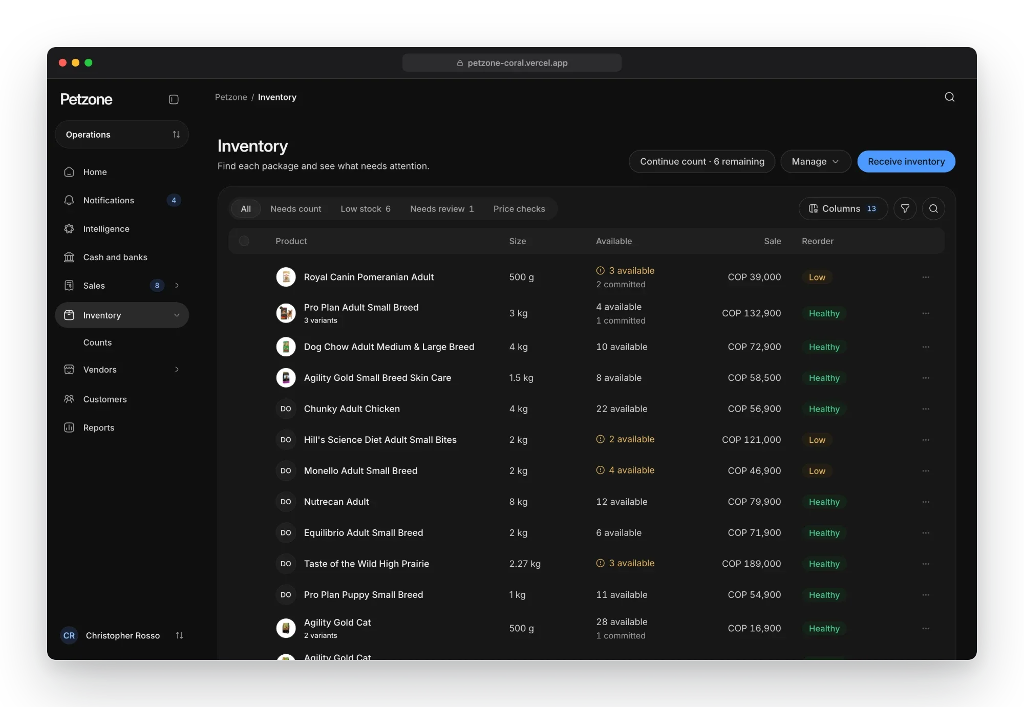 Petzone inventory in the dark theme: products with size, available and committed stock, sale price and reorder status